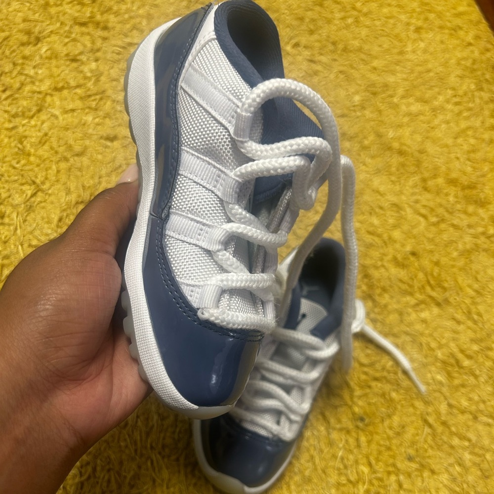 Jordan 11s. Navy blue and white.